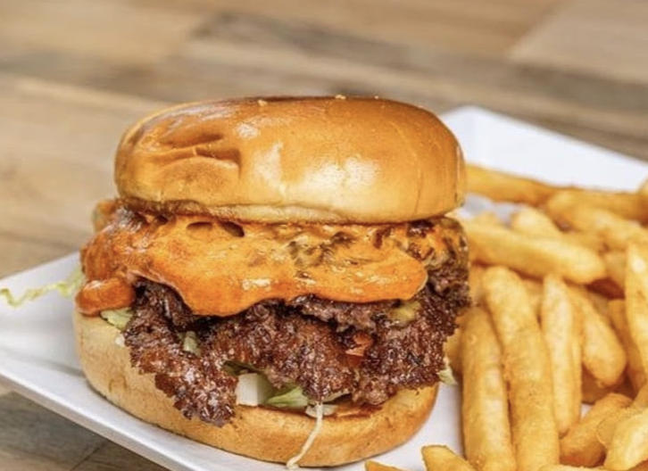 over the Cuse deli & grill signature dishes Ultimate Chop Cheese w/ FriesRodeo Bbq Smash Burger w/ FriesSteak Egg & Cheese On A Plain Bagel